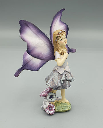 Purple Fairy with Butterfly Wings in the Garden