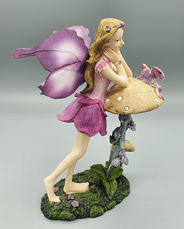 Purple Fairy Resting on Mushroom and Butterfly Wings